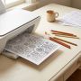 A coloring book page printed at home with colored pencils nearby