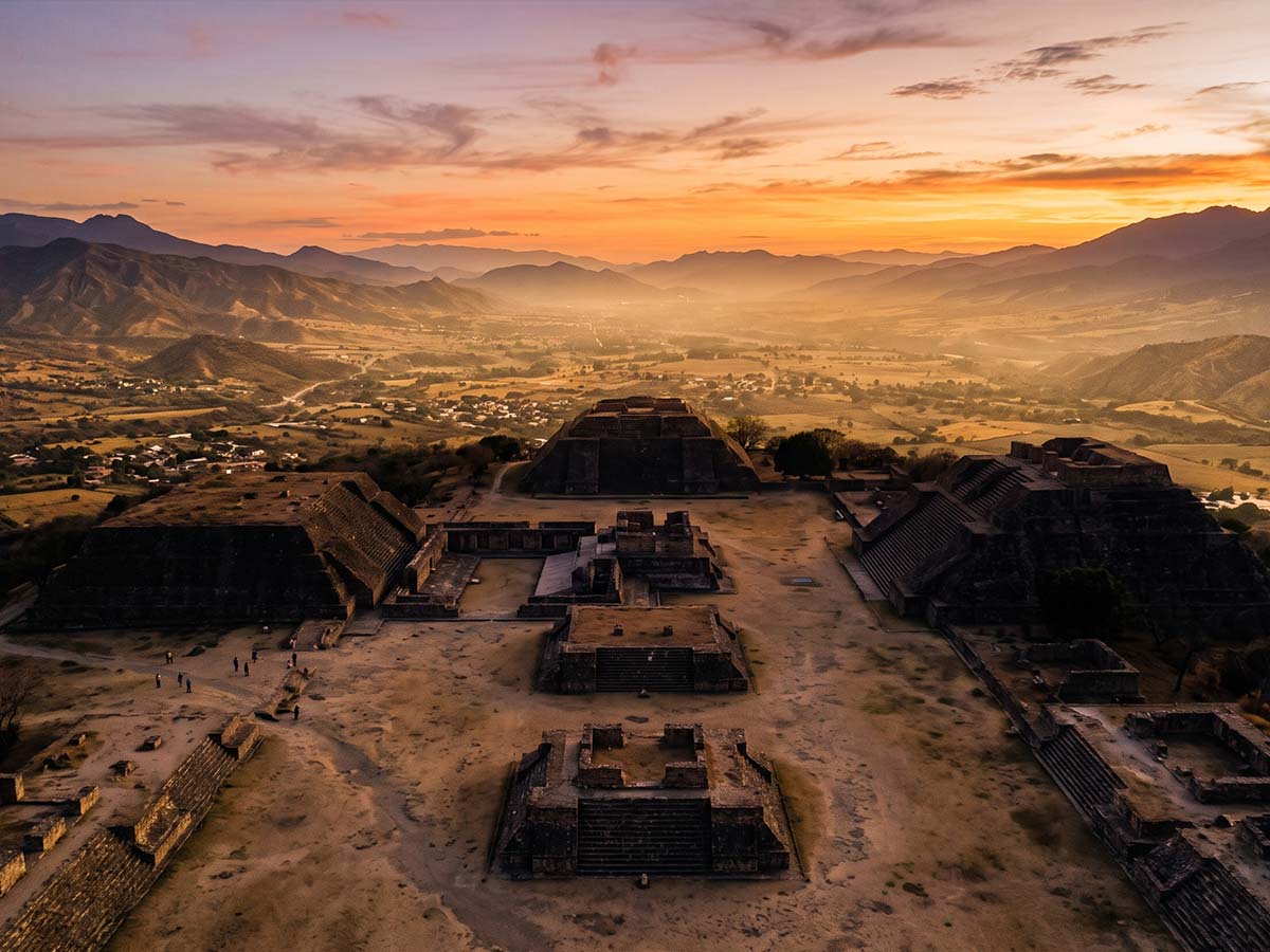 Aerial view of Monte Albán ruins at dusk with Oaxacan valley below