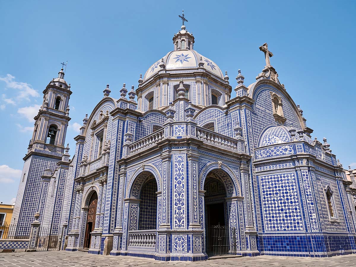 Talavera-tiled facade of a colonial church in Puebla at midday