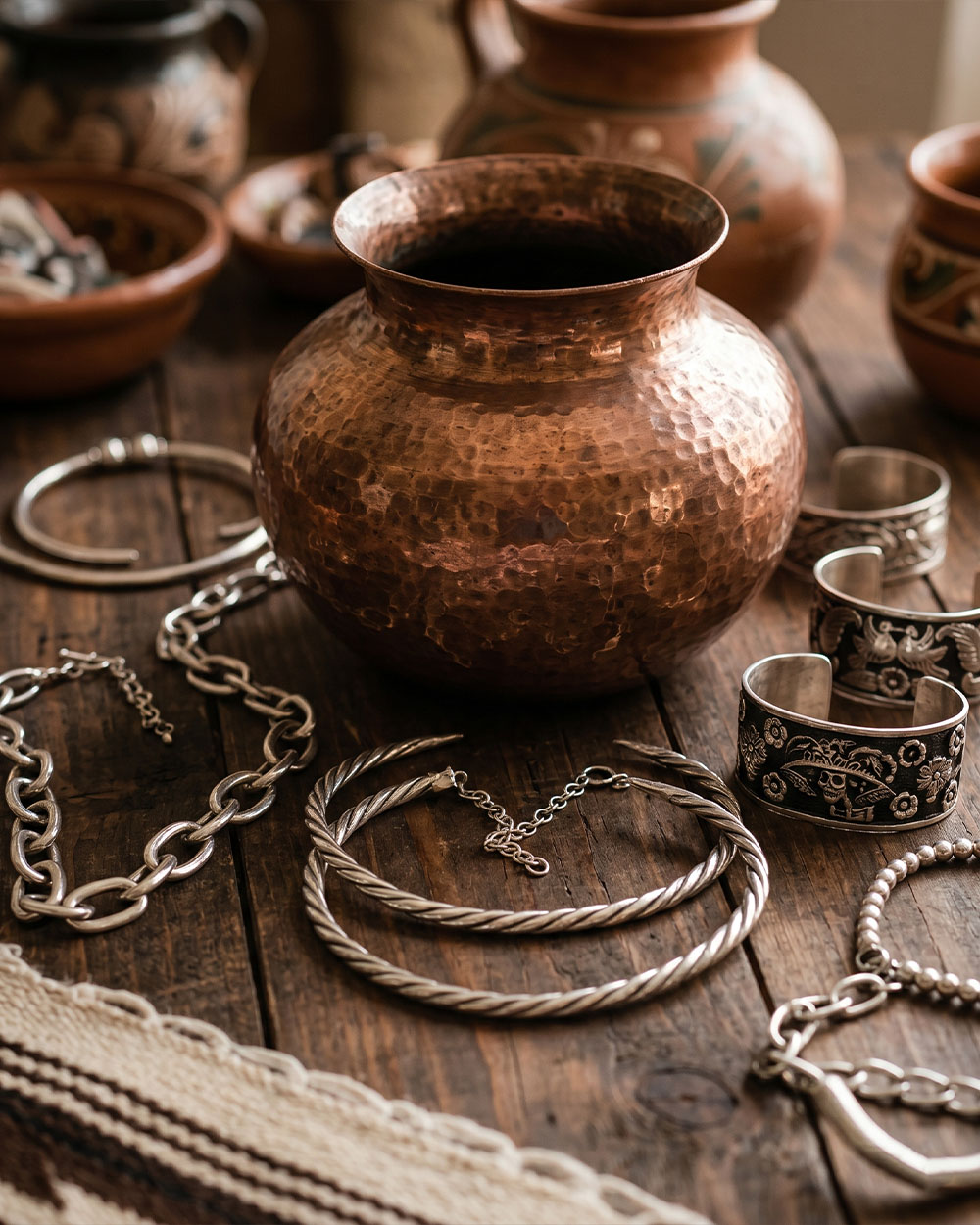 Handcrafted Mexican silver jewelry and hammered copper metalwork pieces