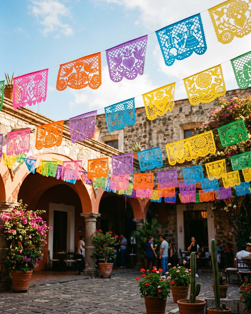 Colorful papel picado cut-paper banners with intricate designs from Puebla, Mexico