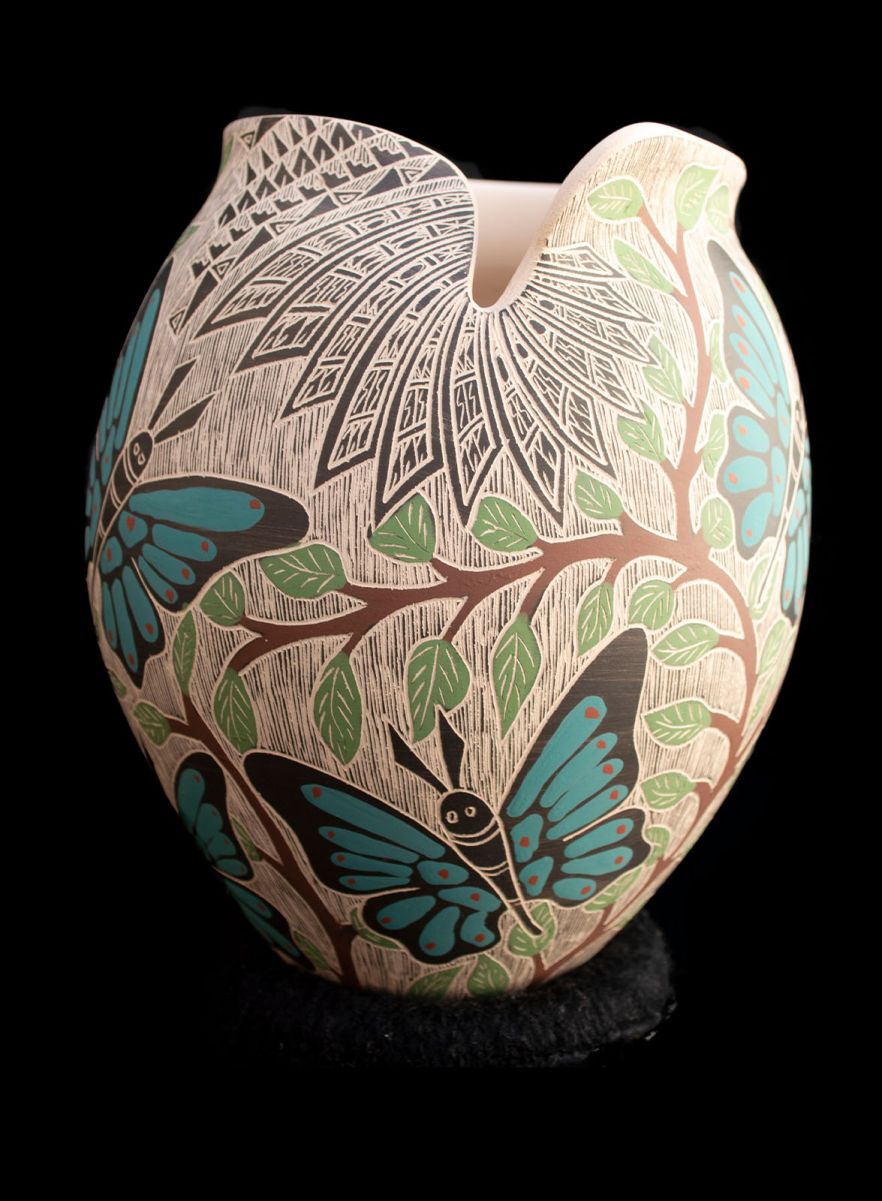 Mata Ortiz sgraffito pottery vessel with turquoise butterflies and green leaf branches by Alex Jurado, side view showing asymmetric rim