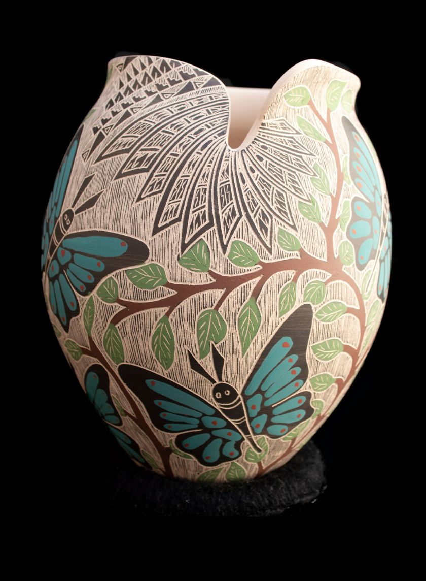 Mata Ortiz sgraffito pottery vessel with turquoise butterflies and green leaf branches by Alex Jurado, side view showing asymmetric rim